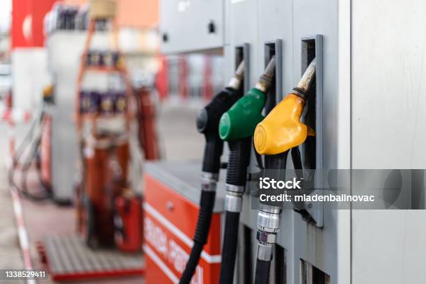 Gas Station Work Stock Photo - Download Image Now - Gasoline, Gas Station, Fuel Pump