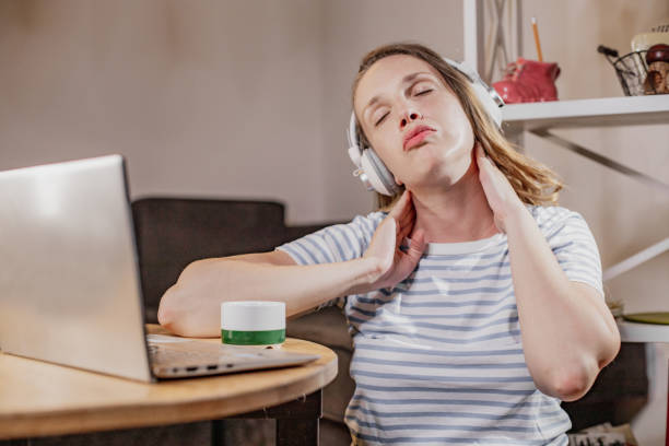 istock Neck pain while working at home 1338533926