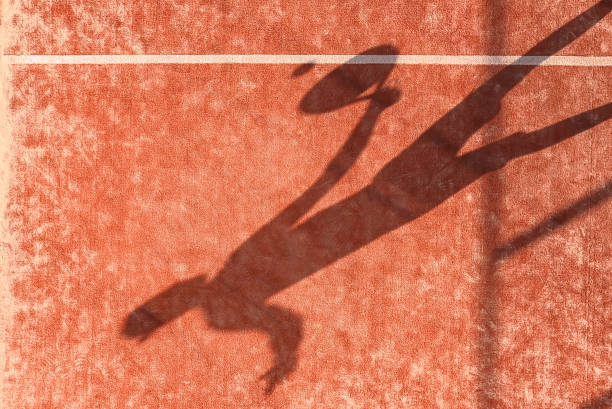 istock Shadow of a paddle tennis player with a racket 1338534253