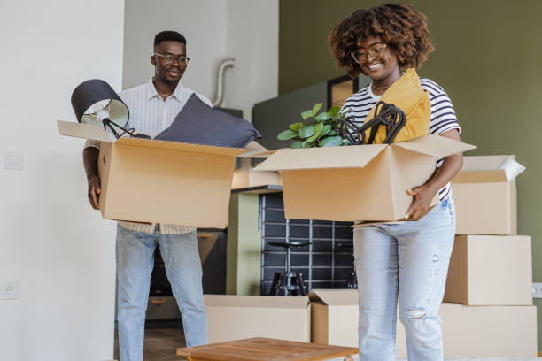 istock Carrying boxes into new apartment 1338540383