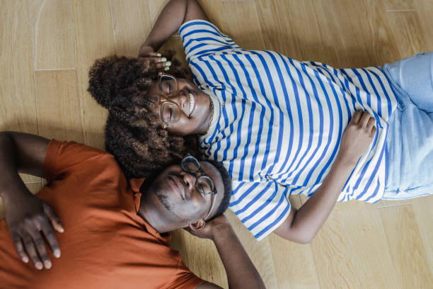 istock Young couple lying on the floor 1338540453
