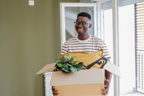 istock Young man moving into a new apartment 1338540454