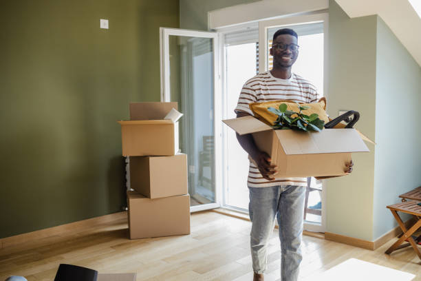 istock Young man moving into a new apartment 1338541082