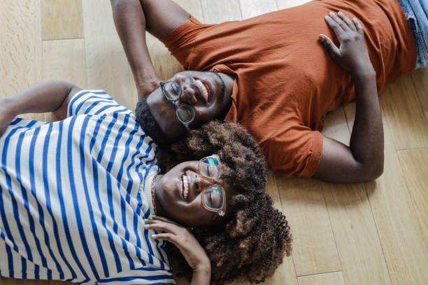 istock Young couple lying on the floor 1338541215