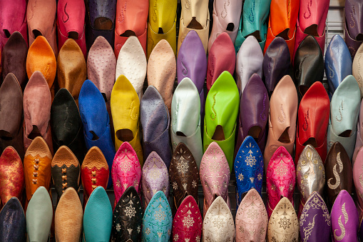 Colorful shoes (babouches) for sale at a market in Meknes.