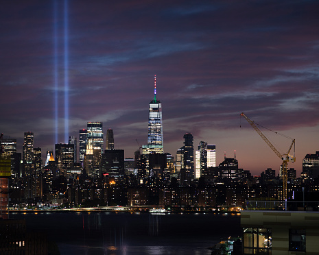 View of the lower Manhattan skyline with tribute in lights illuminated.