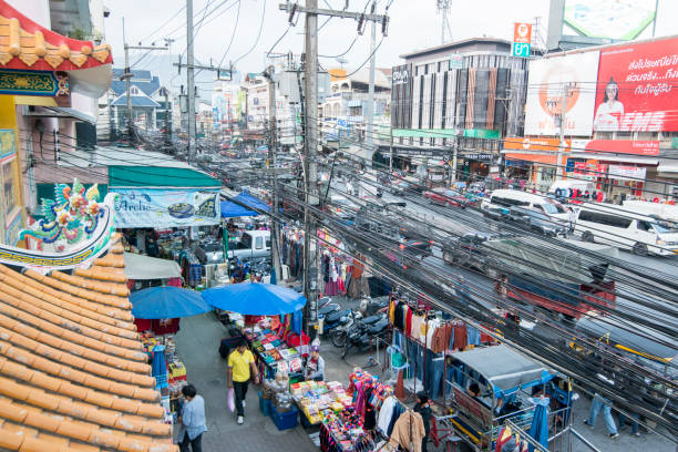 power lines at the mainroad at the Thai Border in the town of Mae Sai on the Border to Myanmar in the Chiang Rai Province in North Thailand.   Thailand, Mae Sai, November, 2019