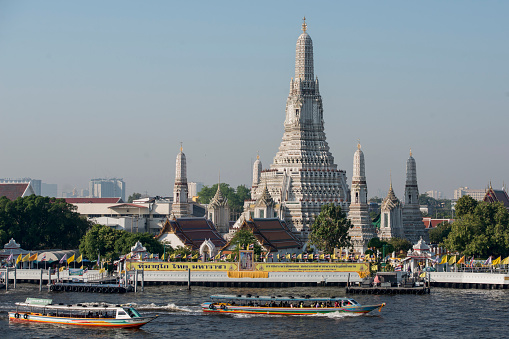 the Wat Arun Temple on the Chao Phraya River in the city of Bangkok in Thailand in Southest Asia.  Thailand, Bangkok, November, 2019