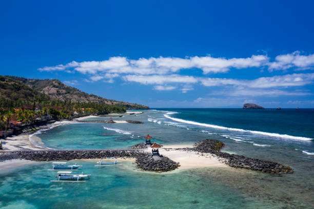 Aerial coastline of Candi Dasa beach town in Bali Indonesia stock photo