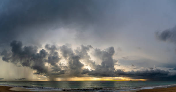 istock Dramatic sky with massive rain clouds over the Indian Ocean on the scenic sunset in Hikkaduwa, Sri Lanka, in the winter season. Stitched high-resolution panorama. 1338564708