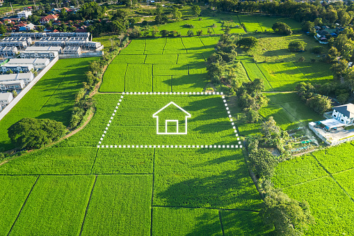Land or landscape of green field in aerial view or bird eye view. Include agriculture farm, icon of residential, home or house building and land plot. That real estate or property for dream concept to build, construction, owned, sale, rent, buy, purchase, mortgage and investment in Chiang Mai of Thailand.