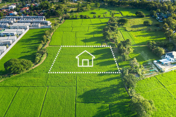 Land or landscape of green field in aerial view and home or house icon. Land or landscape of green field in aerial view or bird eye view. Include agriculture farm, icon of residential, home or house building and land plot. That real estate or property for dream concept to build, construction, owned, sale, rent, buy, purchase, mortgage and investment in Chiang Mai of Thailand. only land stock pictures, royalty-free photos & images