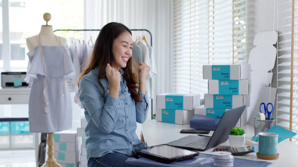 istock Young attractive beautiful female entrepreneur fund borrower crazy joyful ecstatic face gesture hand yes feeling amazed in peer to peer P2P lending finance or crowdfunding network microfinance approve 1338581001