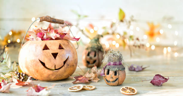 istock Autumn Jack O' Lantern against an old wood background 1338584463