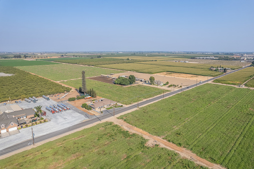 Aerial view of a rural small town in Central California. Farm land and water Canal.