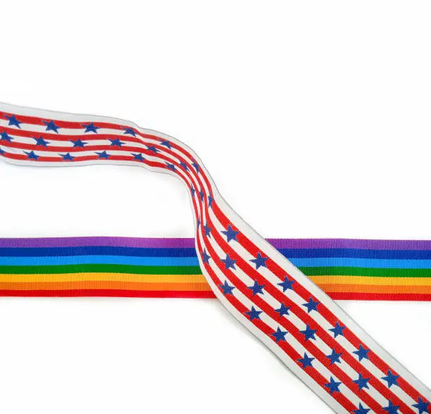 USA flag and rainbow flag ribbons, isolated on white background