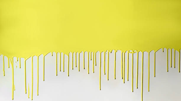 Yellow paint dripping on white wall Yellow paint dripping on white wall leaked pictures stock pictures, royalty-free photos & images