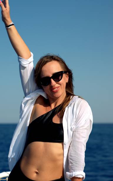 istock Happy girl posing on a yacht 1338589450