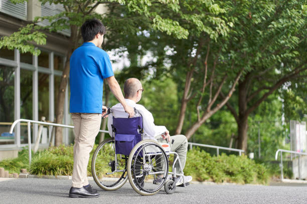 istock Caregiver supporting the elderly in wheelchairs 1338593125