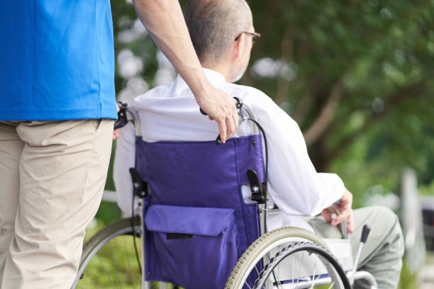 istock Caregiver supporting the elderly in wheelchairs 1338593134