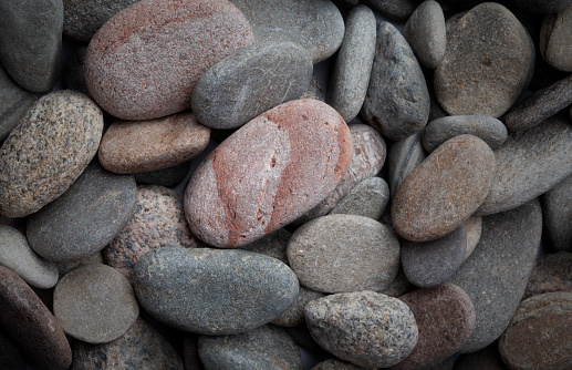 Mixed river stones in natural setting.