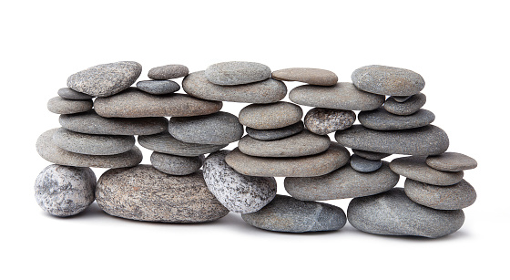 River stones arranged as simple rock wall