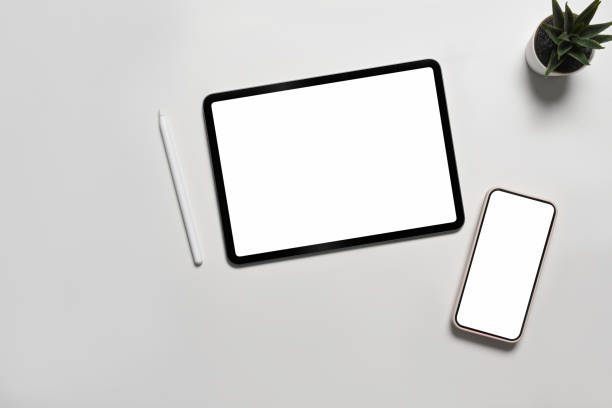 istock Mock up digital tablet and smart phone with blank screen on white background. 1338599010