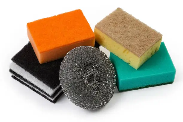 Kitchen hard flat fleecy and colored synthetic sponges with harder layer, metal sponge made of steel strip on a white background