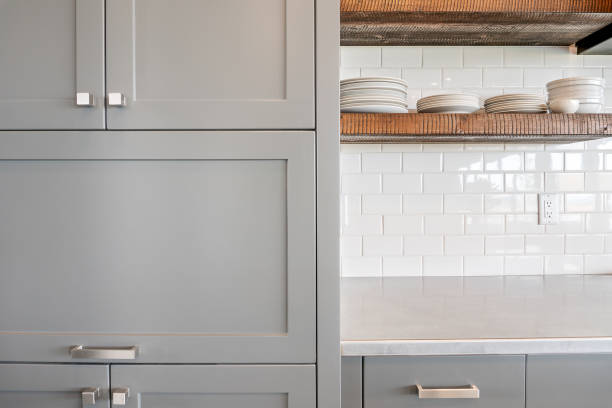 istock White subway tile backsplash with floating shelves in new kitchen 1338599169