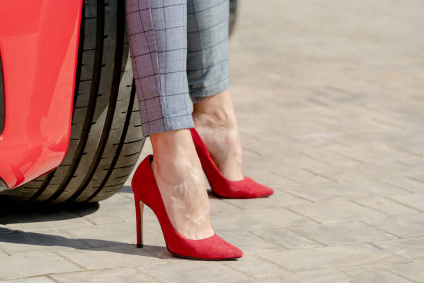 istock Girl in red shoes 1338602115