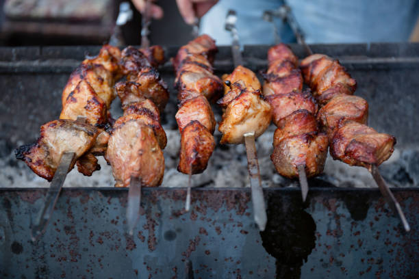 istock meat skewers in a barbecue picnic on an open fire 1338605062
