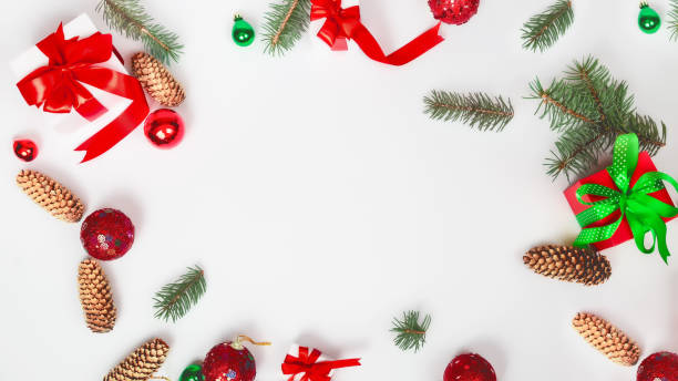 istock Christmas background with red Christmas decorations on a white background with a Christmas tree. Merry Christmas greeting card, banner. Winter holidays theme. Happy new year concept. Christmas frame. Copy space 1338605094