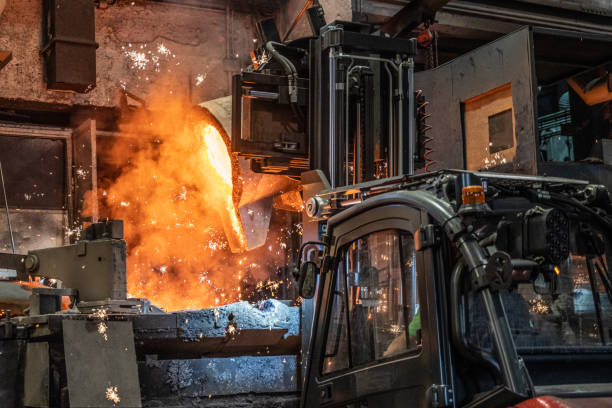 istock Pouring of liquid molten metal to casting mold using forklift 1338613204