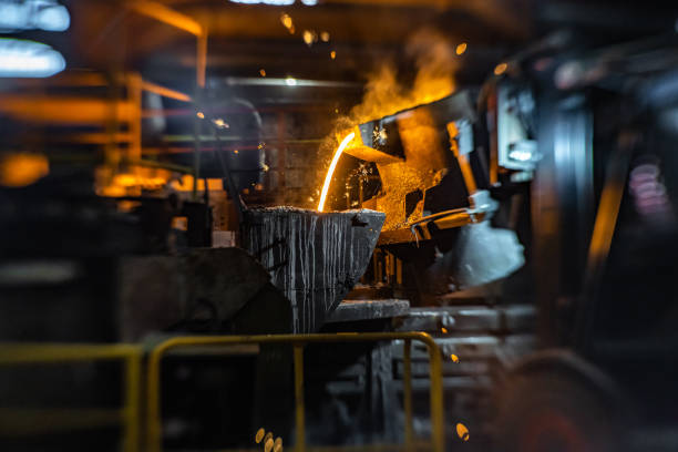 istock Pouring of liquid molten metal to casting mold using forklift 1338613211