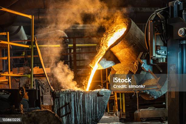Pouring Of Liquid Molten Metal To Casting Mold Using Forklift Stock Photo - Download Image Now