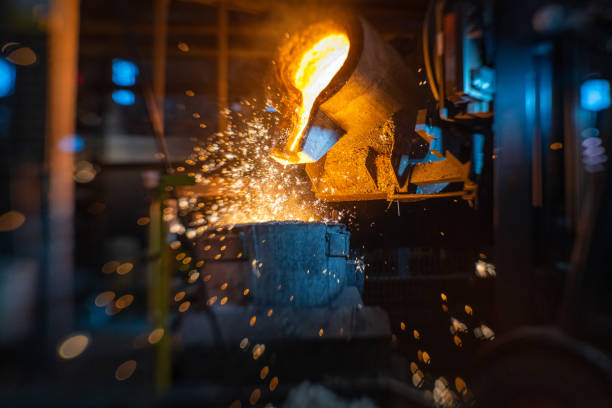istock Pouring of liquid molten metal to casting mold using forklift 1338613232