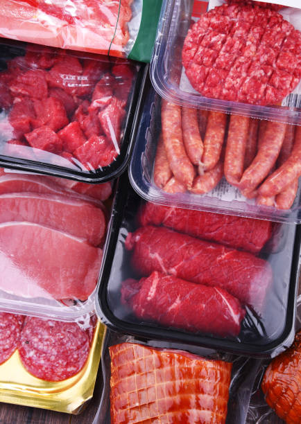 istock Composition with packages of assorted meat products 1338613386