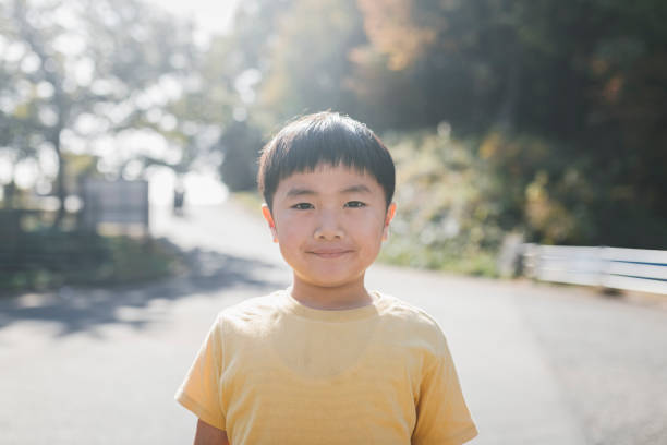istock Asian boy playing in the park 1338613508