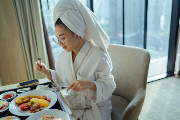 istock Young girl enjoying her breakfast 1338614880