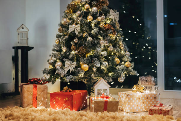 istock Christmas tree and plenty of presents underneath 1338615946