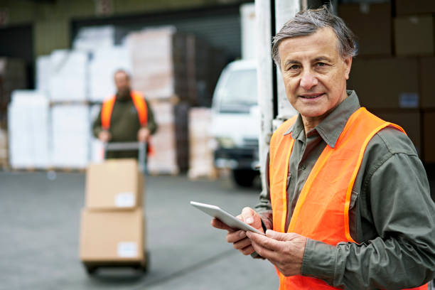 istock Candid Portrait of Senior Male Loading Dock Worker 1338616183