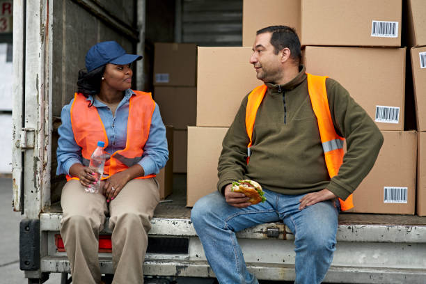 istock Transportation Coworkers Taking a Break From Loading Truck 1338616195