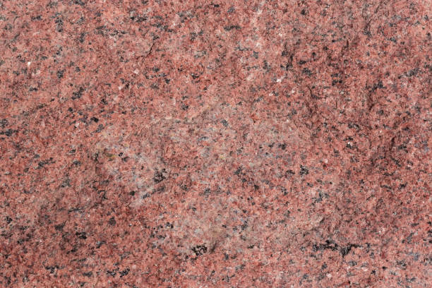 istock Torn edge of the red granite block, texture, background 1338617618