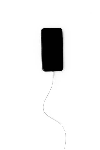 istock Cord charger with cable for mobile phone or laptop, top view 1338622351