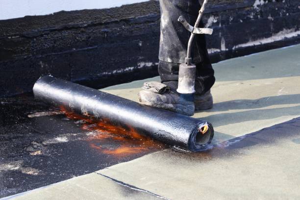 istock Professional flat roof waterproofing with bitumen welded sheeting 1338623093
