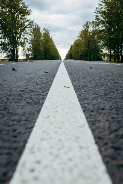istock Asphalt road with white markings,   background 1338624086