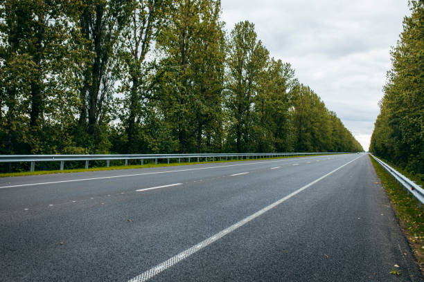 istock Asphalt road with white markings,   background 1338624151