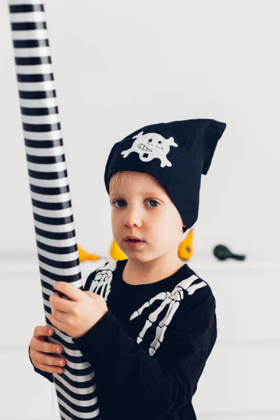 istock Cute Boy Dressed As Skeleton Pirate For Halloween 1338624602