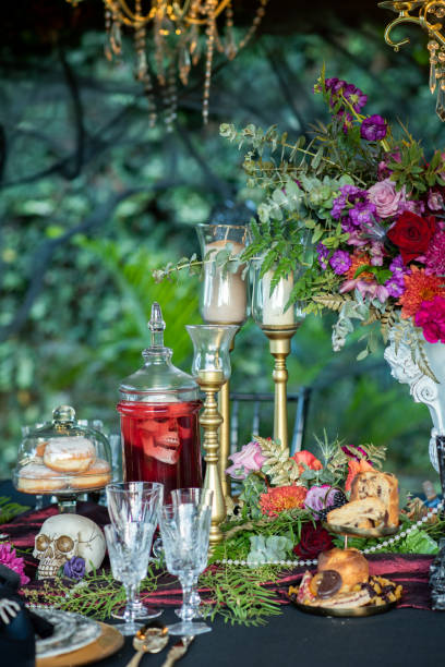 Banquet table with food and decor for Halloween celebration