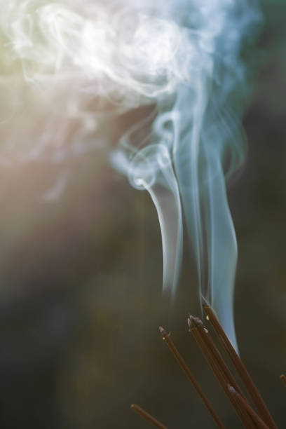 istock A beautiful pattern of backlit smoke from burning incense and incense sticks outdoors. The concept of rituals, religious ceremonies in the open air. Meditation, self-knowledge, spirituality. Copyspace 1338628446